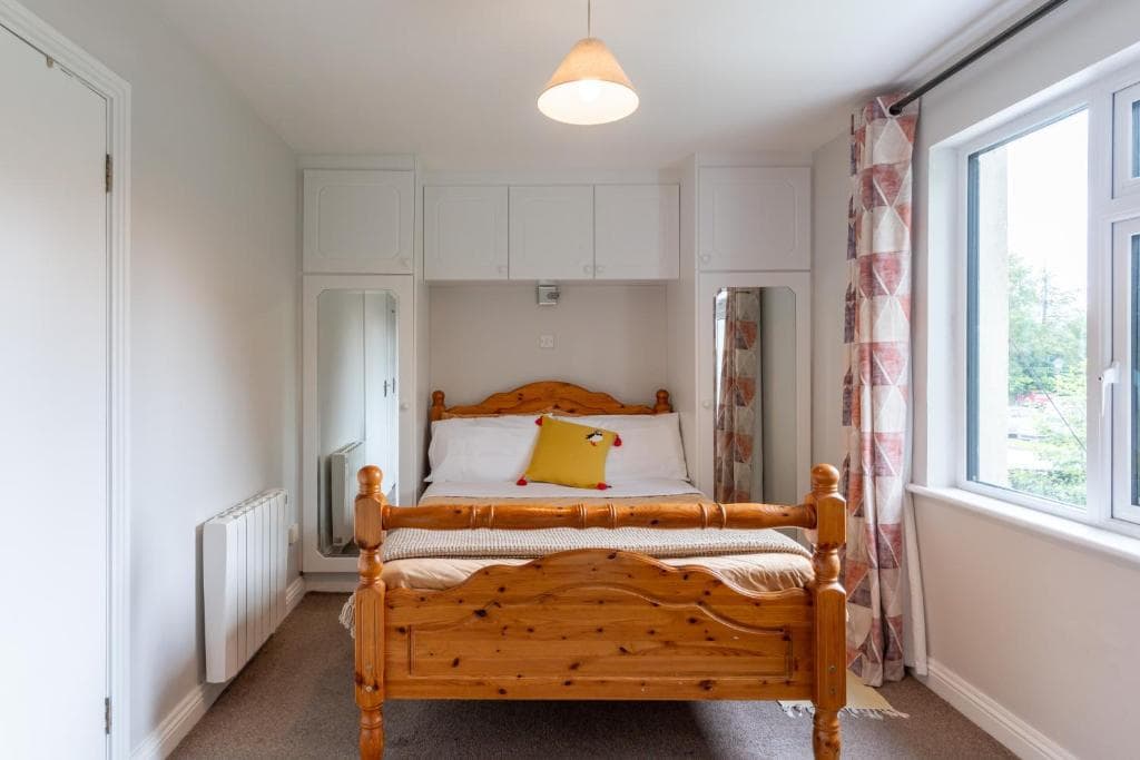 Bedroom 1 — double bed with en suite at Tully's Home